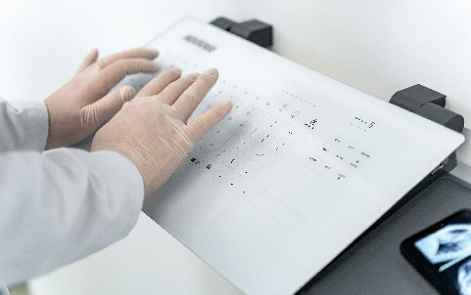 An Indusense touchpanel beingused with gloves